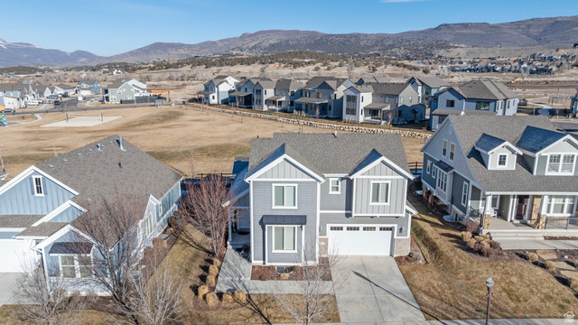 2745 Red Barn Road South Heber City, UT 84032 - Photo 47 of 51 Aerial perspective of suburban area featuring a mountain backdrop