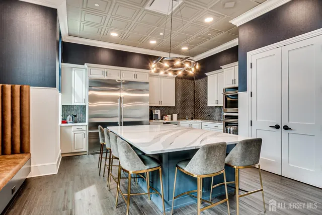 a kitchen with a table and chairs in it