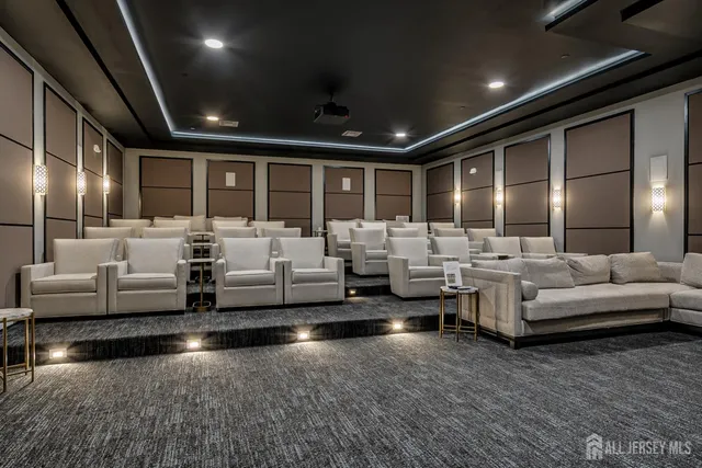 a living room with furniture and chandelier