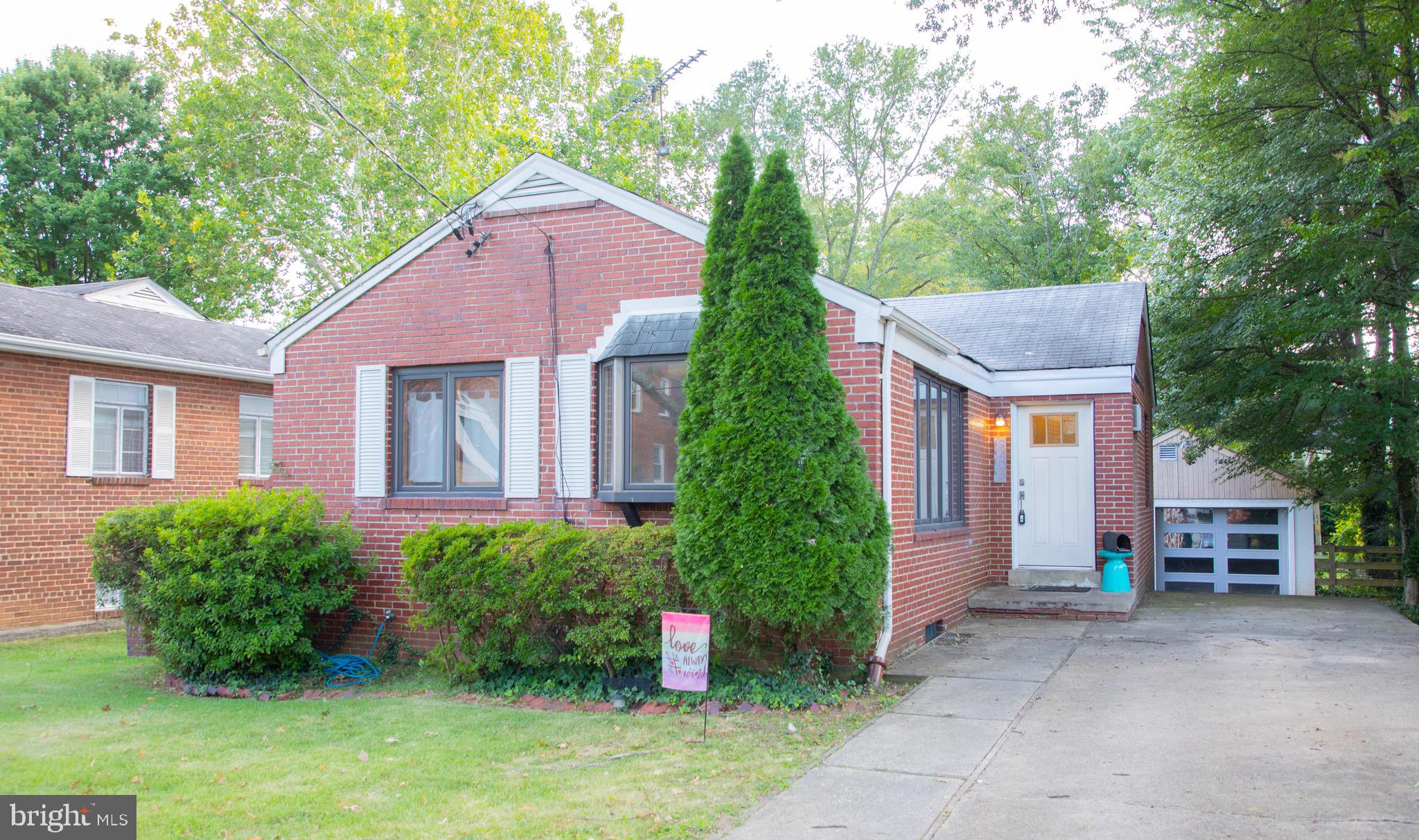 9406 Seminole Street Silver Spring, MD 20901 - Photo 1 of 32 a front view of a house with garden