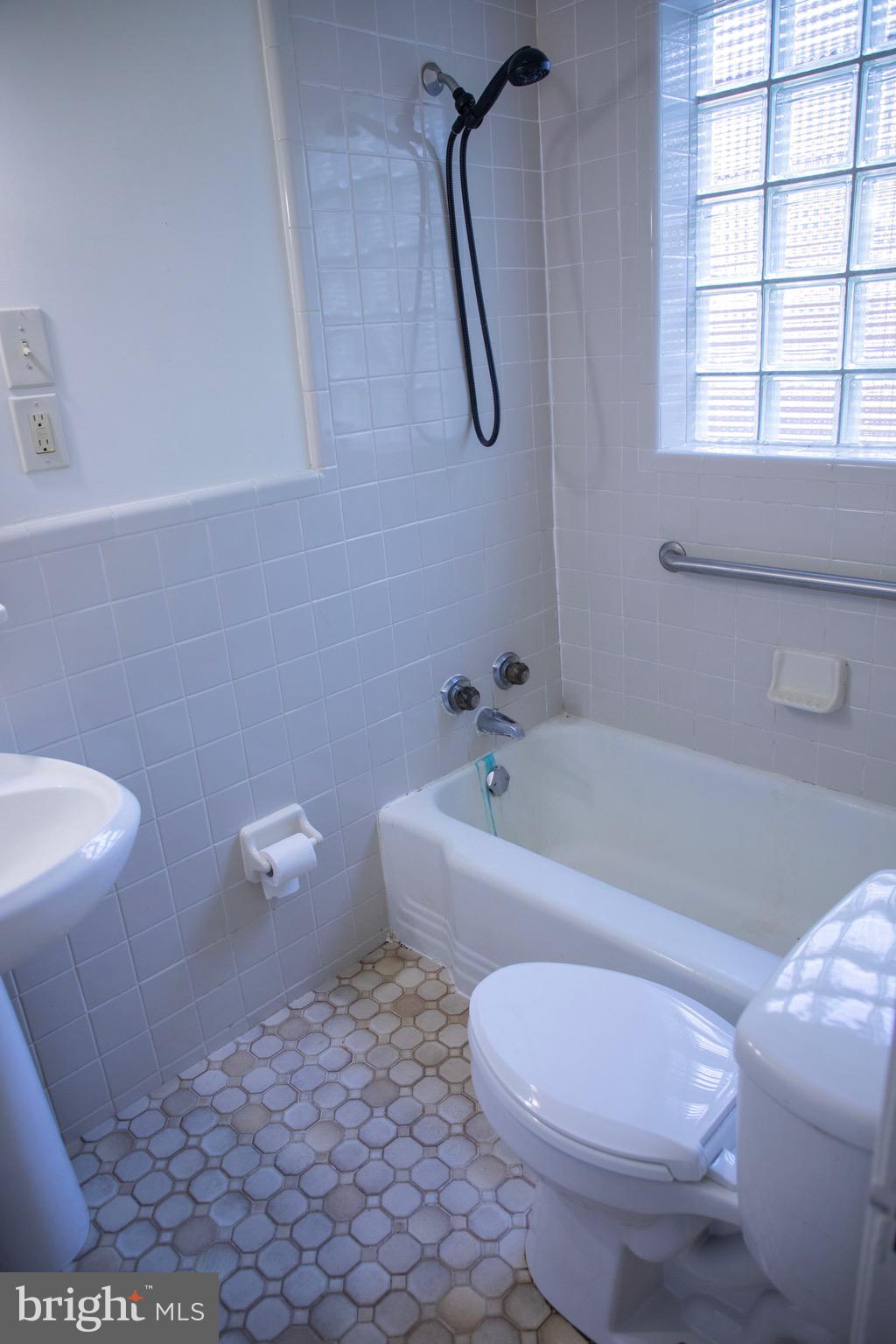 9406 Seminole Street Silver Spring, MD 20901 - Photo 13 of 32 a bathroom with a toilet and a bathtub