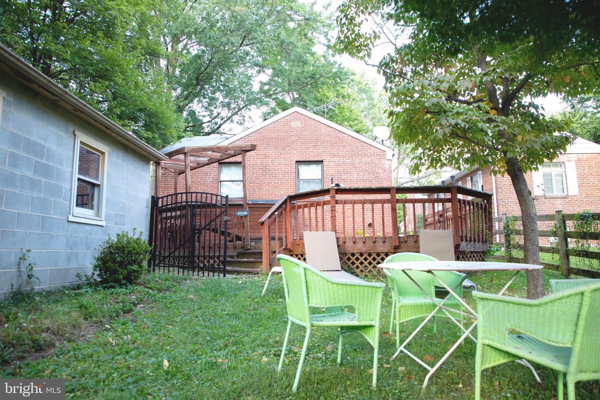 9406 Seminole Street Silver Spring, MD 20901 - Photo 21 of 32 a view of a chair and table in backyard of the house