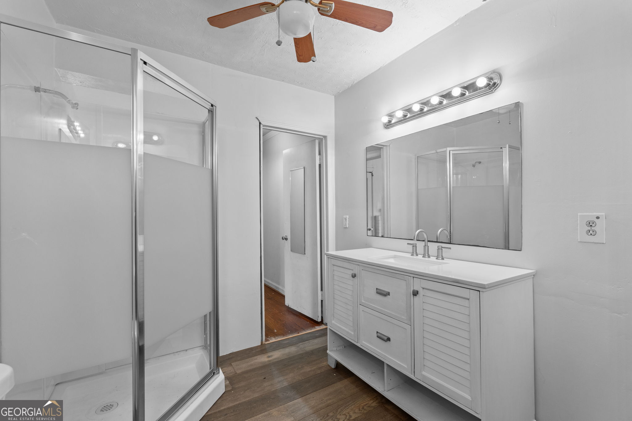 49 Frost Road Bowdon, GA 30108 - Photo 30 of 60 a spacious bathroom with a double vanity sink a large mirror and shower