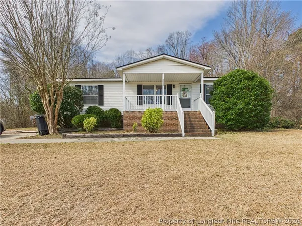 front view of a house with a yard
