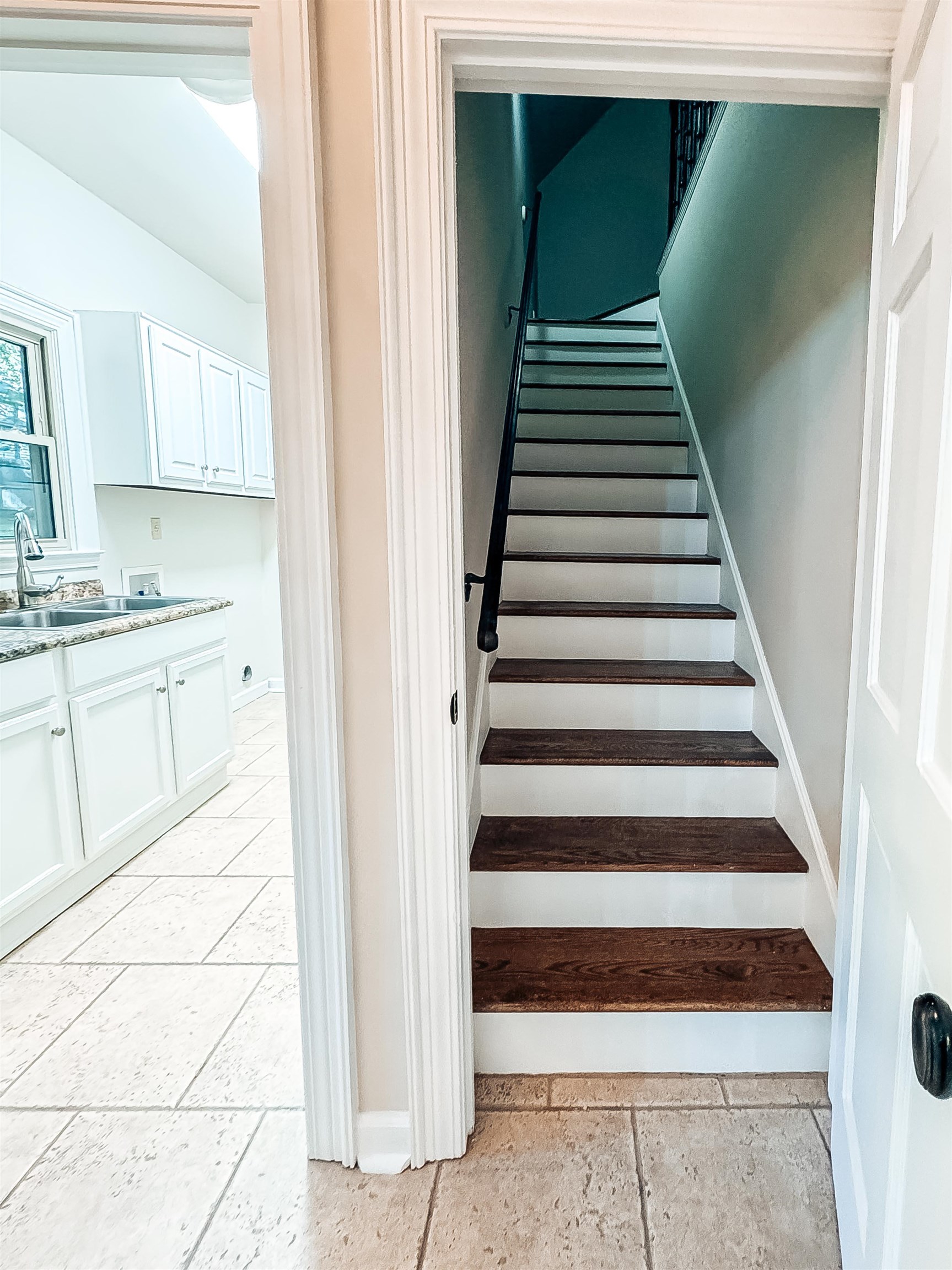 832 South Tree Drive Collierville, TN 38017 - Photo 23 of 40 Hardwood treads with white risers and a black handrail