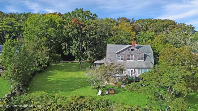 a view of a garden with a building in the background