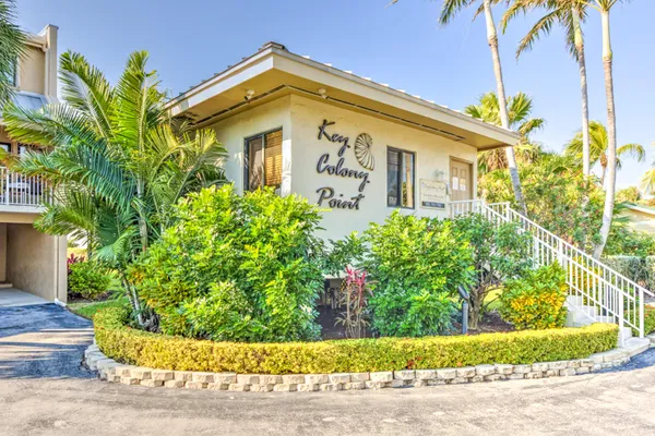 a bathroom with a granite countertop sink a large mirror and vanity