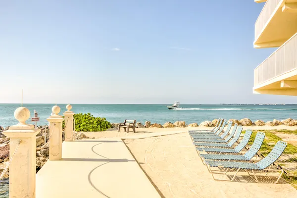 a view of swimming pool with outdoor seating and city view