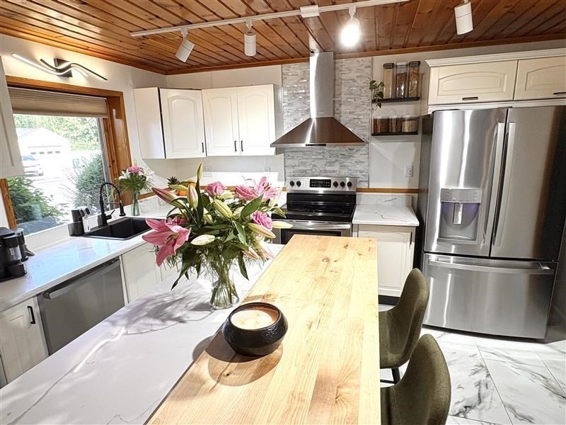 2 Pat Drive Danvers, MA 01923 - Photo 1 of 29 a kitchen with stainless steel appliances a sink a stove a refrigerator and cabinets