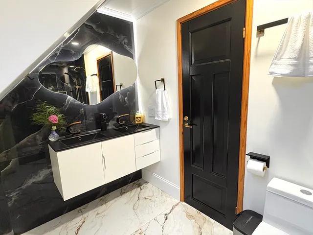 a kitchen with a refrigerator and sink