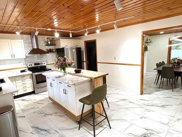 a very nice looking kitchen with a large window