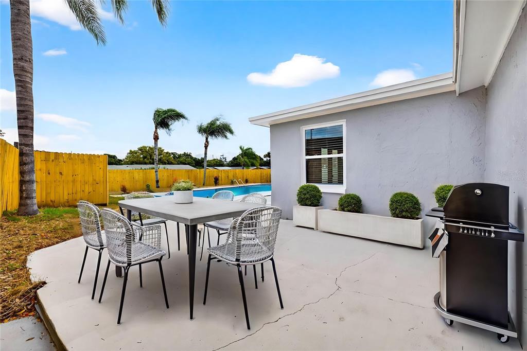 3420 Chickadee Drive Holiday, FL 34690 - Photo 2 of 15 a dining room with furniture and wooden floor