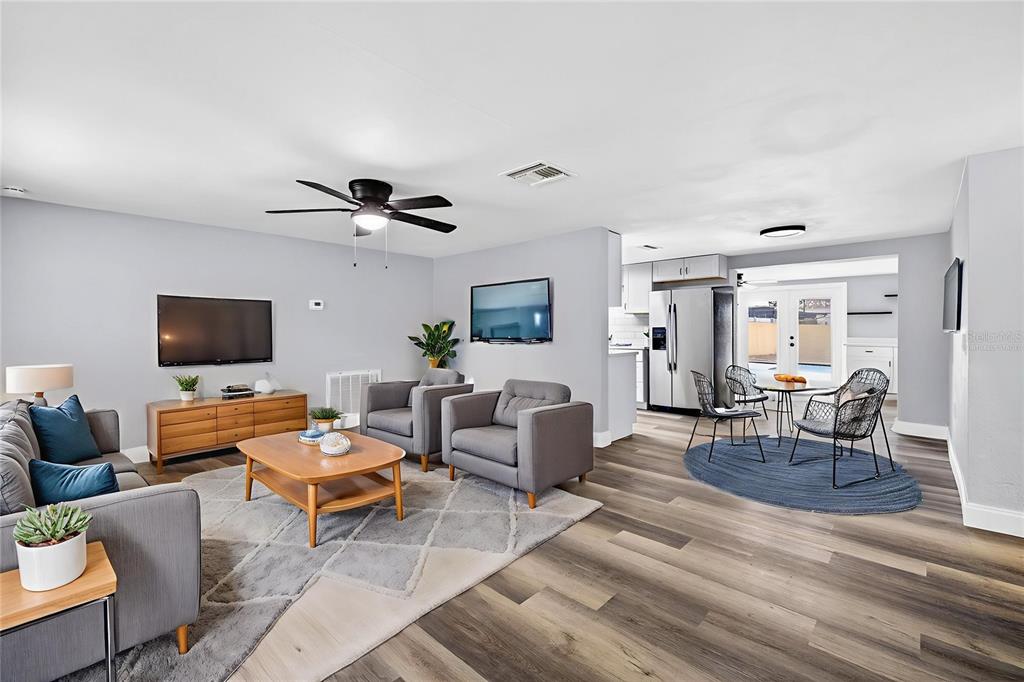 3420 Chickadee Drive Holiday, FL 34690 - Photo 4 of 15 a living room with furniture and a flat screen tv