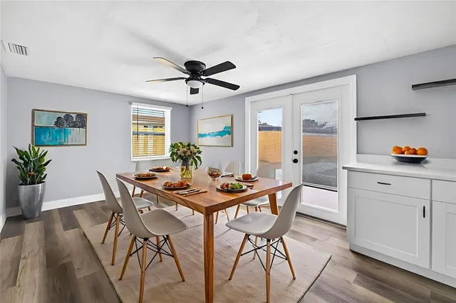 a view of swimming pool with outdoor seating and ocean view