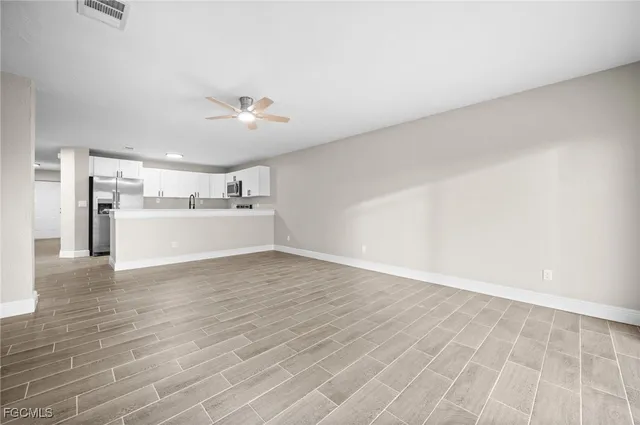 a view of a kitchen with a stove cabinets and wooden floor
