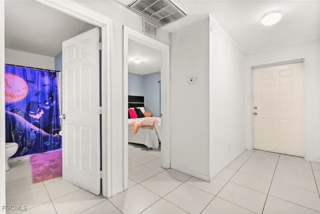 a bedroom with a bed and a shower