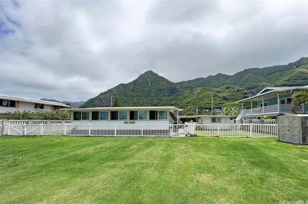 a view of a house with a big yard
