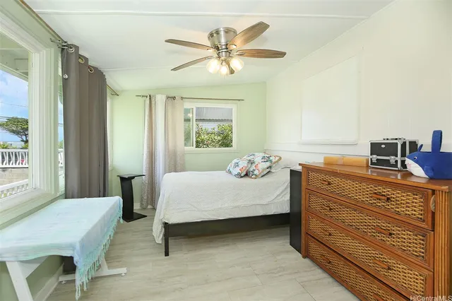 a bedroom with a bed and a table