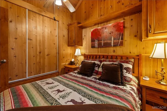 a bed room with a bed and a window