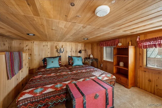 a bedroom with a bed and a walk in closet