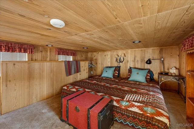 a bedroom with a bed and a table