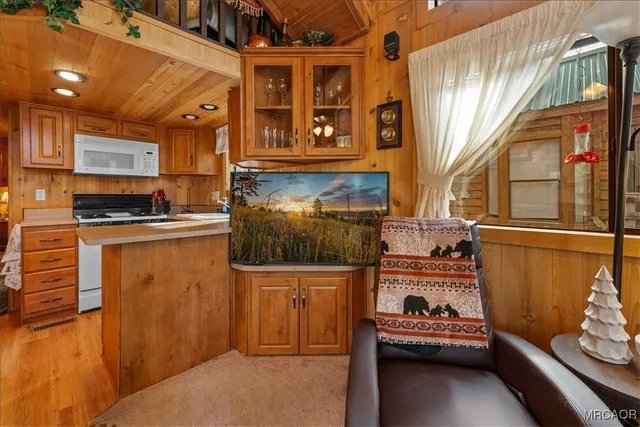 a kitchen with stainless steel appliances a refrigerator and a stove