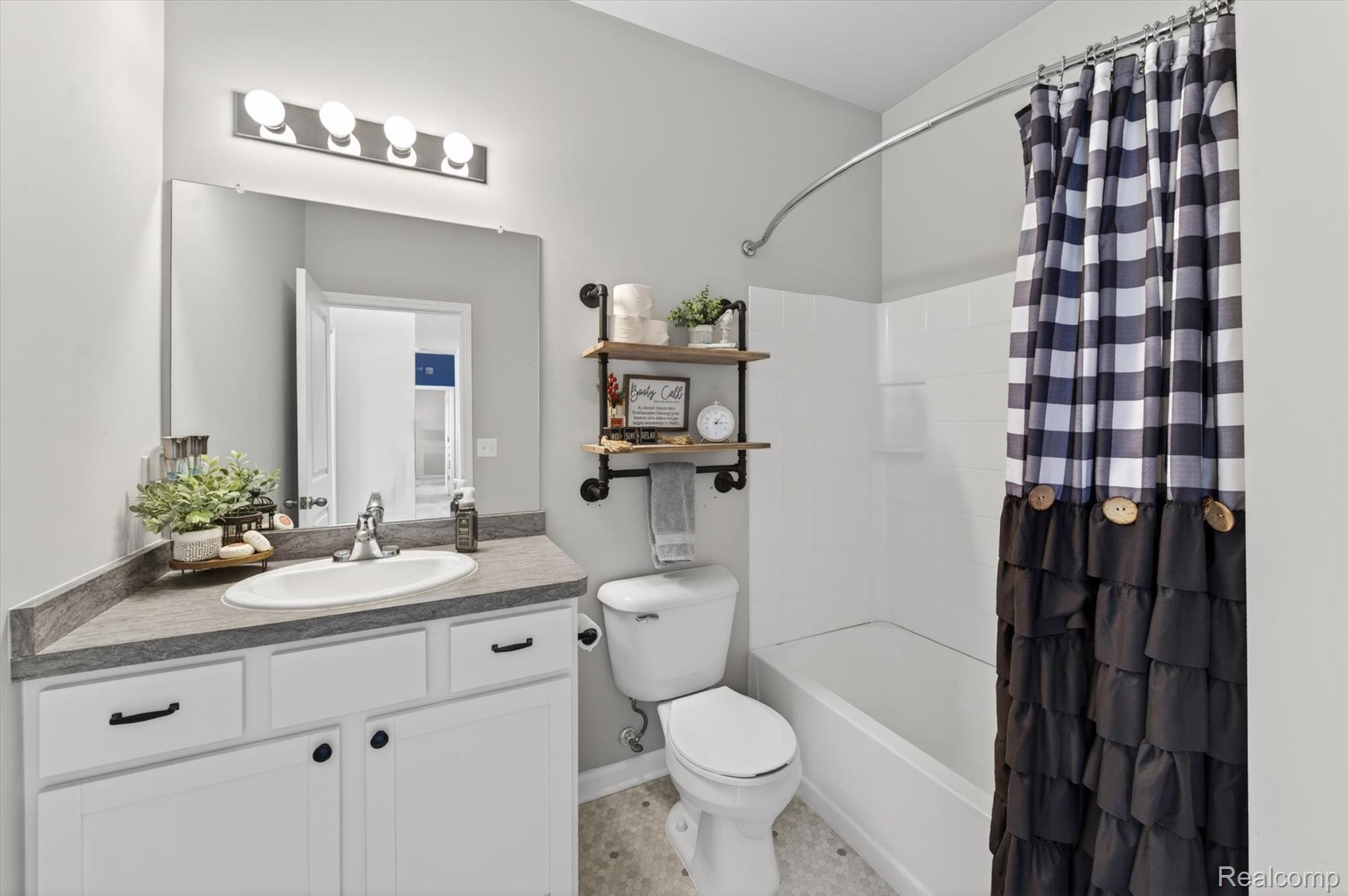 9789 Ridge Run Street Howell, MI 48855 - Photo 21 of 23 Full bathroom with neutral finishes, extended vanity, and tub/shower combination.
