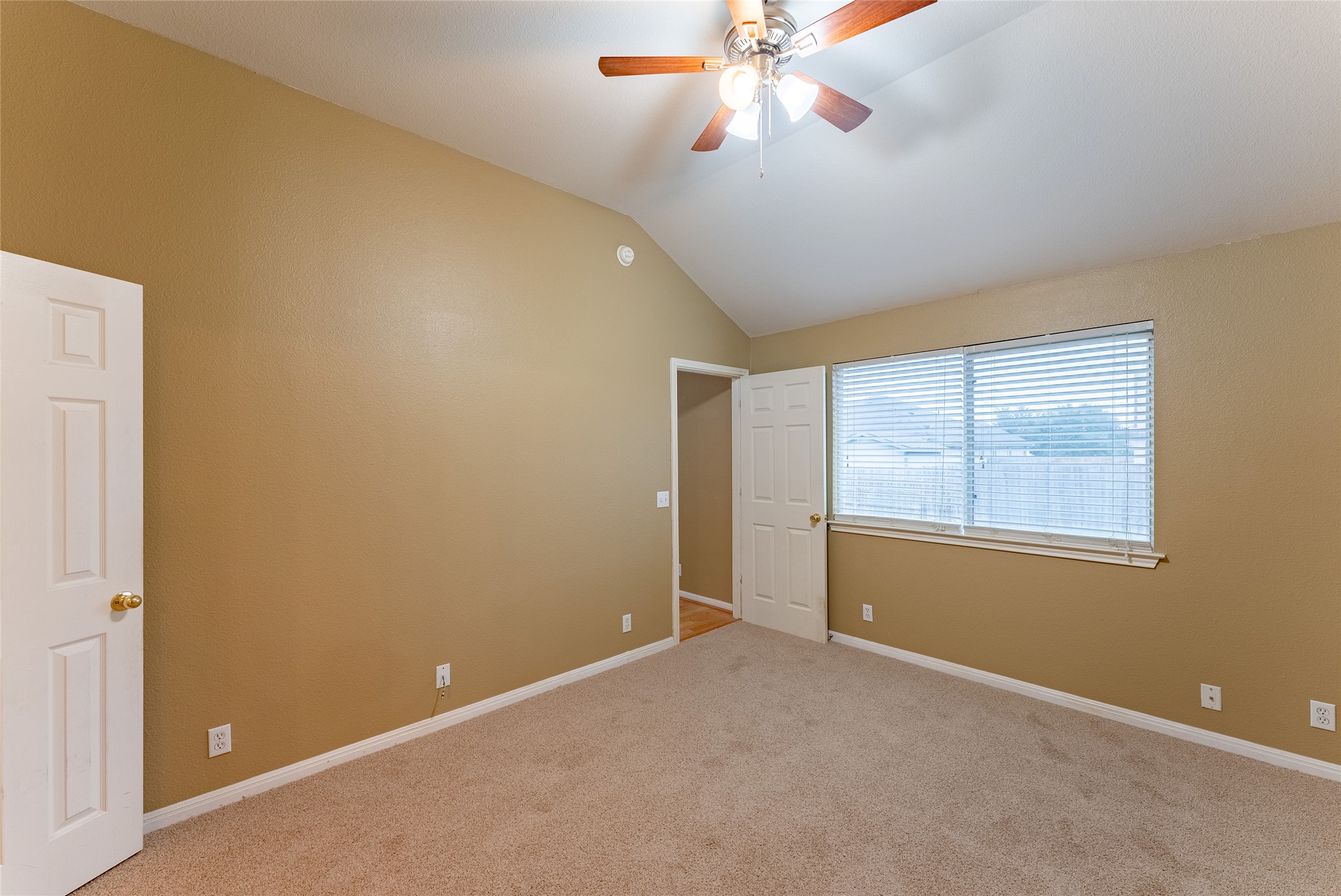 109 Granite Shoals Drive Kyle, TX 78640 - Photo 13 of 22 a view of an empty room with a window