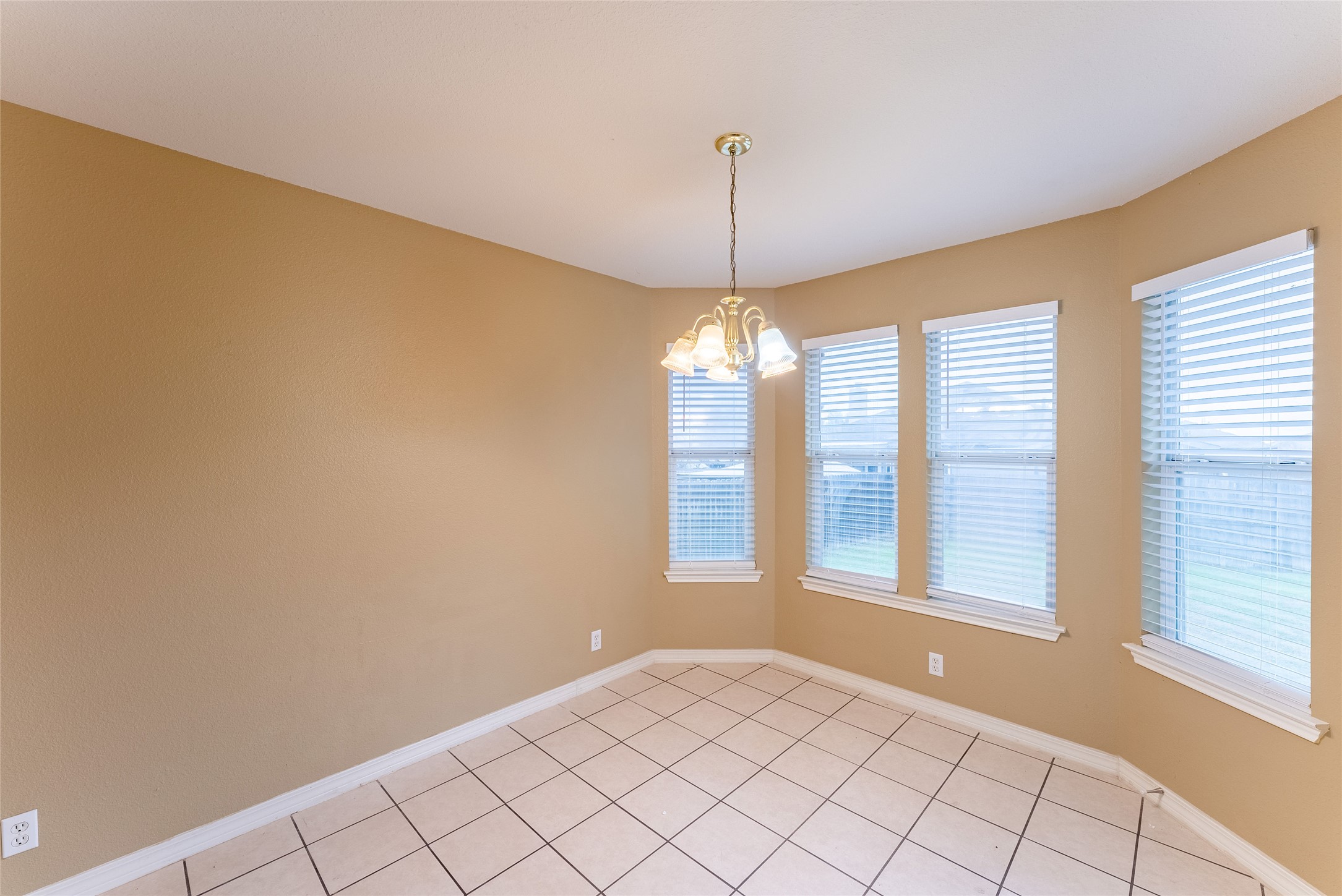 109 Granite Shoals Drive Kyle, TX 78640 - Photo 16 of 22 a view of an empty room with a window