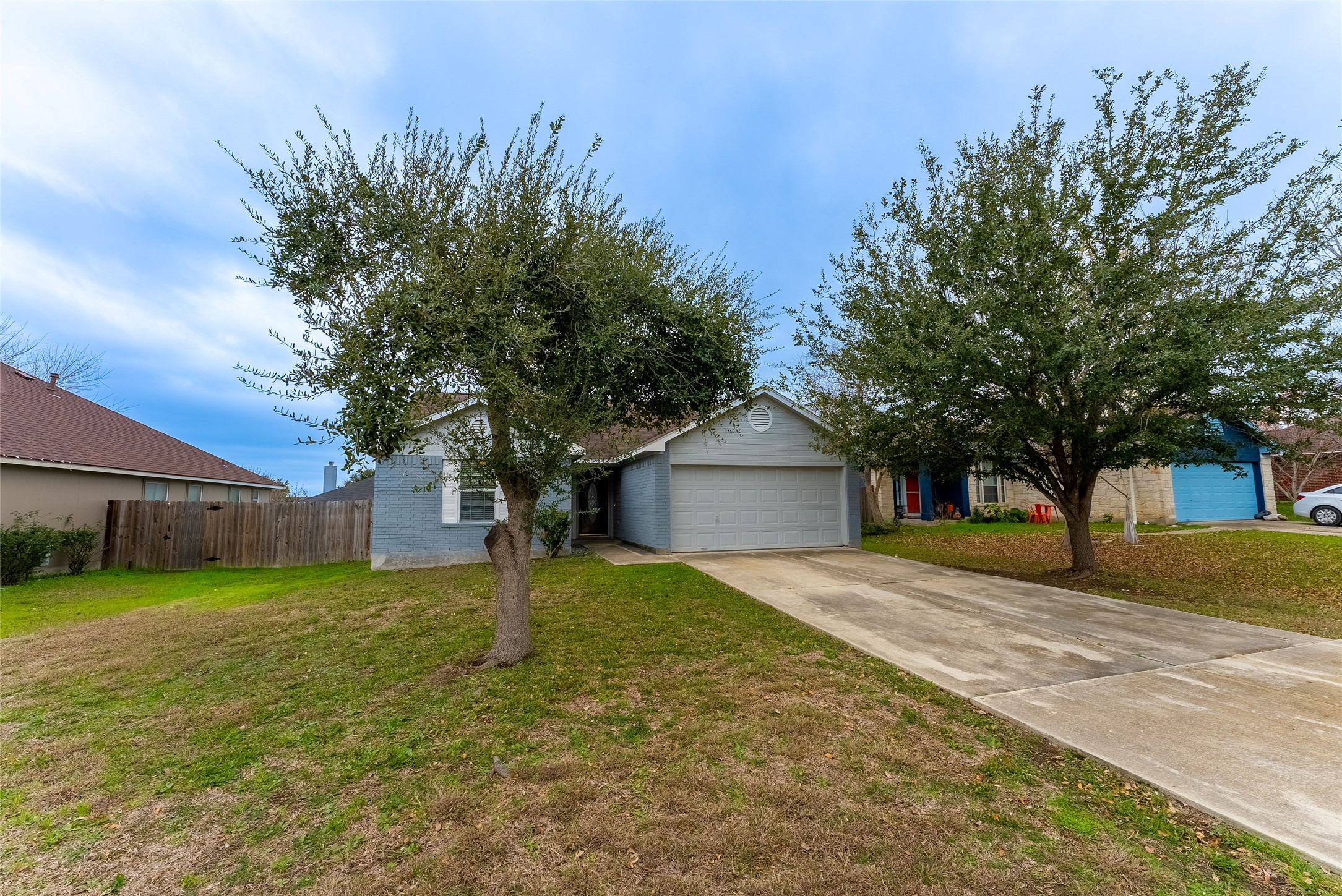 109 Granite Shoals Drive Kyle, TX 78640 - Photo 2 of 22 a view of a house with a yard