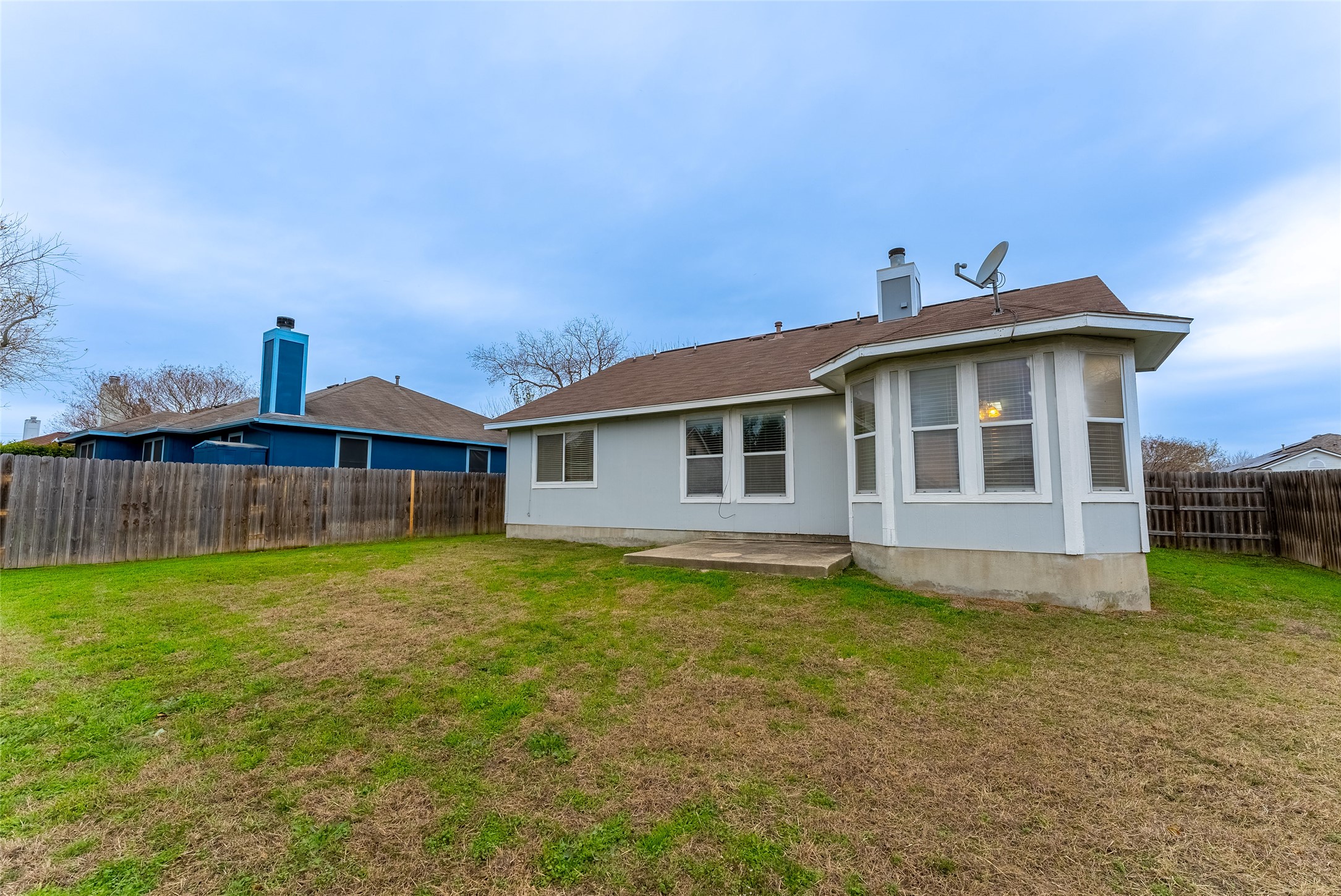 109 Granite Shoals Drive Kyle, TX 78640 - Photo 21 of 22 a view of a house with a yard and sitting area