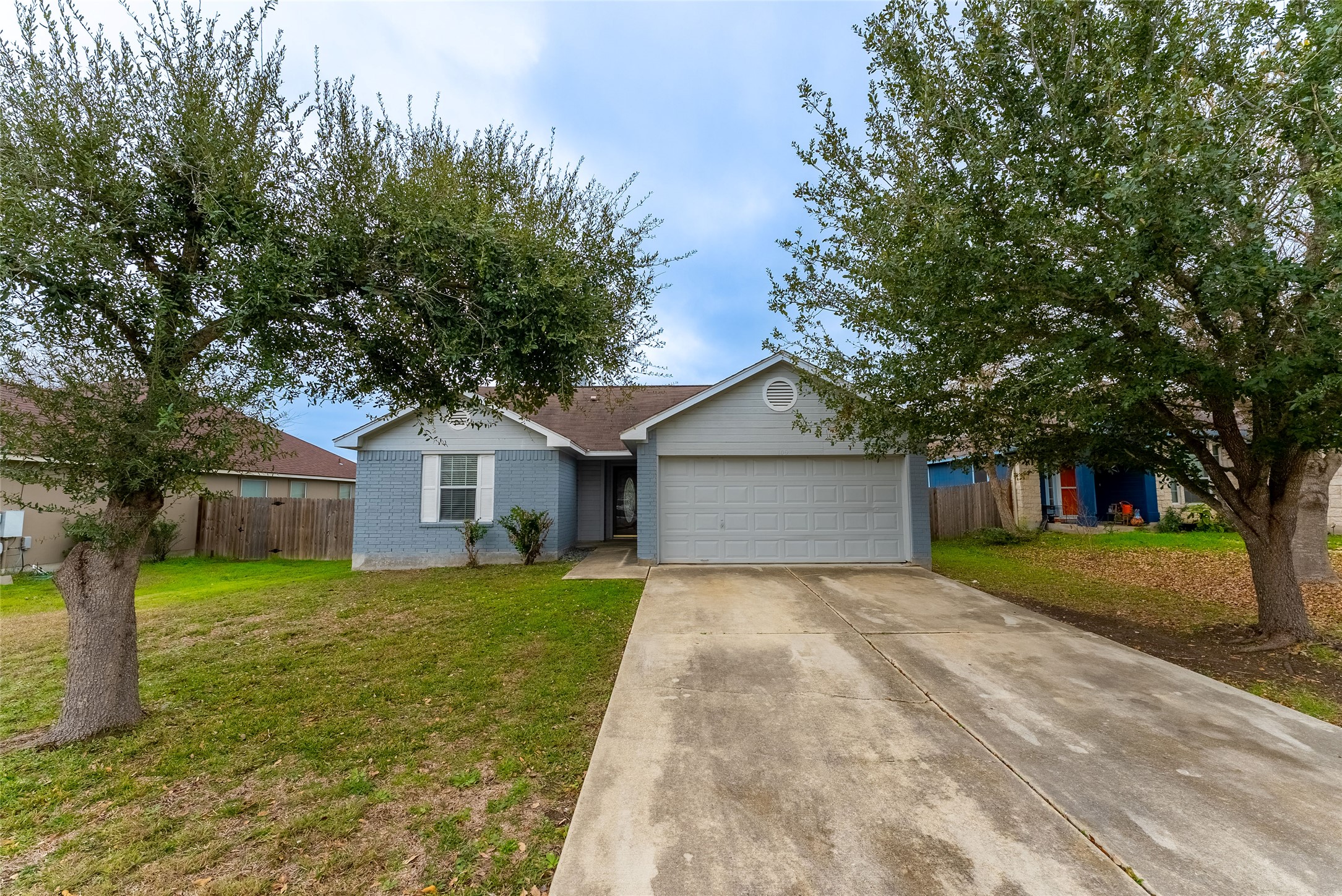 109 Granite Shoals Drive Kyle, TX 78640 - Photo 3 of 22 a front view of a house with yard and trees