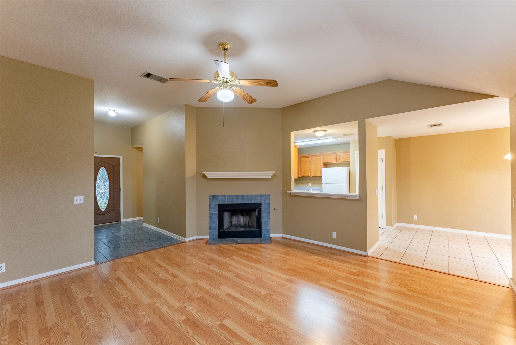 109 Granite Shoals Drive Kyle, TX 78640 - Photo 5 of 22 a view of an empty room with a fireplace and a window