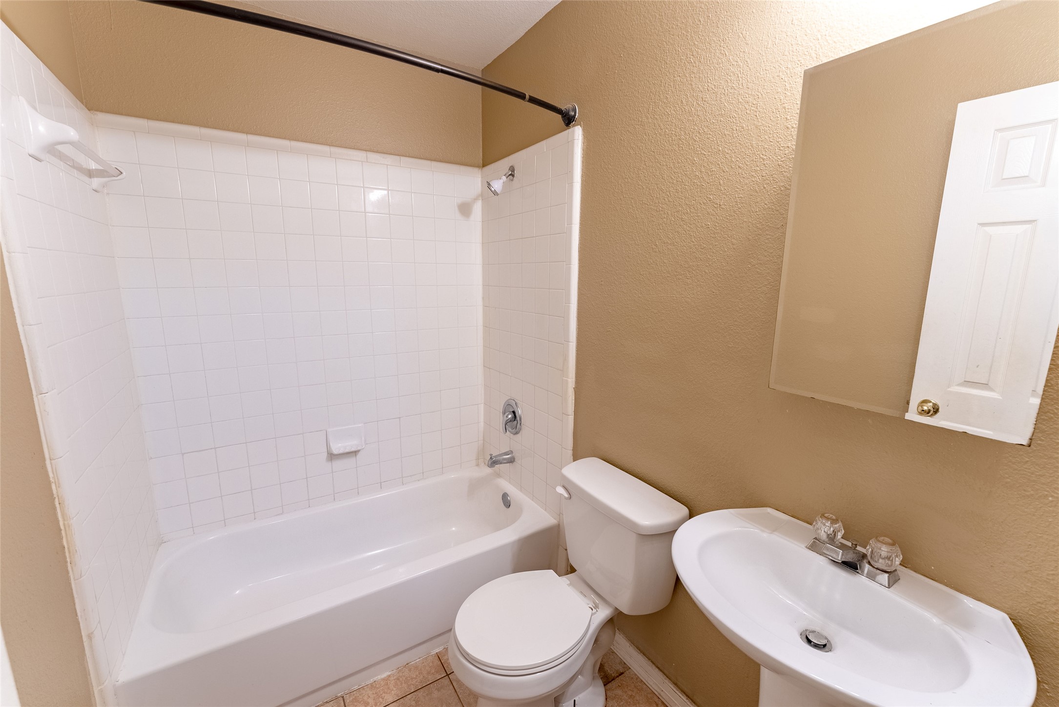 109 Granite Shoals Drive Kyle, TX 78640 - Photo 6 of 22 a bathroom with a sink toilet and shower