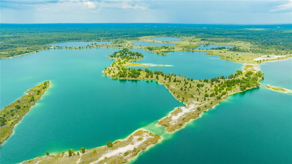 0 Rose Arbor Drive Hernando Beach, FL 34607 - Photo 24 of 24 a view of a lake with a yard