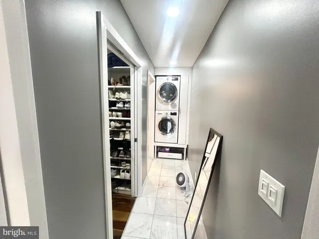 a view of front door with cabinets