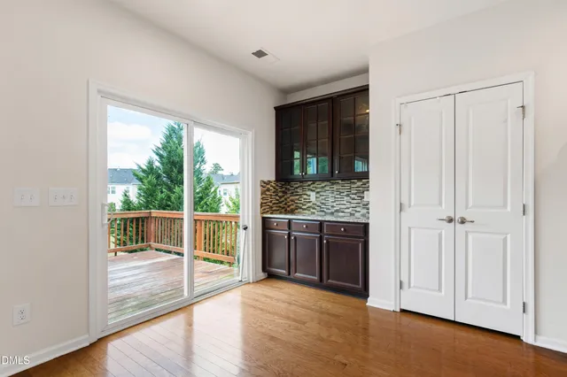 a view of kitchen with granite countertop cabinets and outdoor space