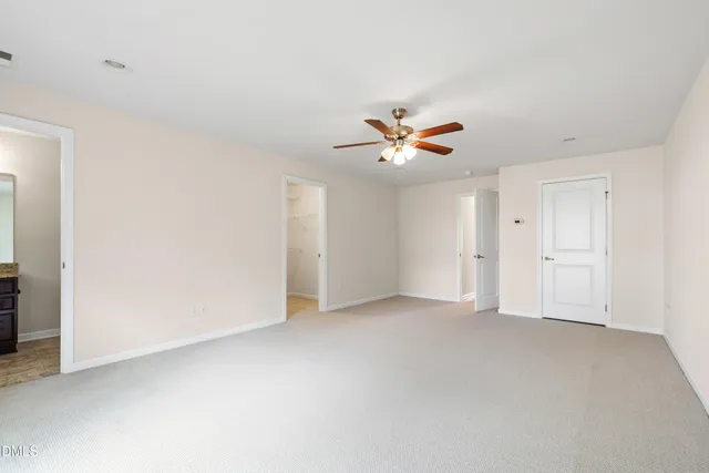 an empty room with a bathroom