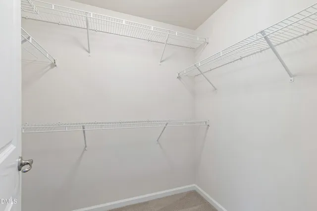 a view of a room with racks on the wall