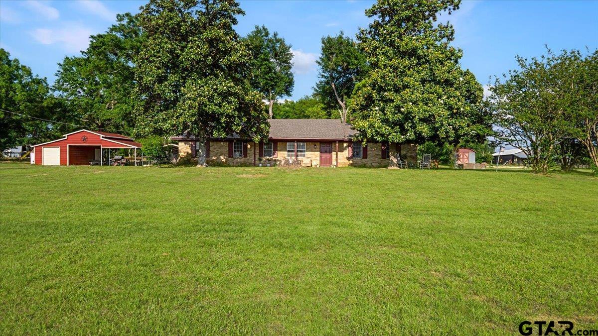 8192 County Road 428 Tyler, TX 75704 - Photo 6 of 38 a house view with a garden space