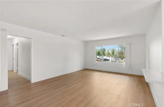 a kitchen with granite countertop a stove a sink and a microwave