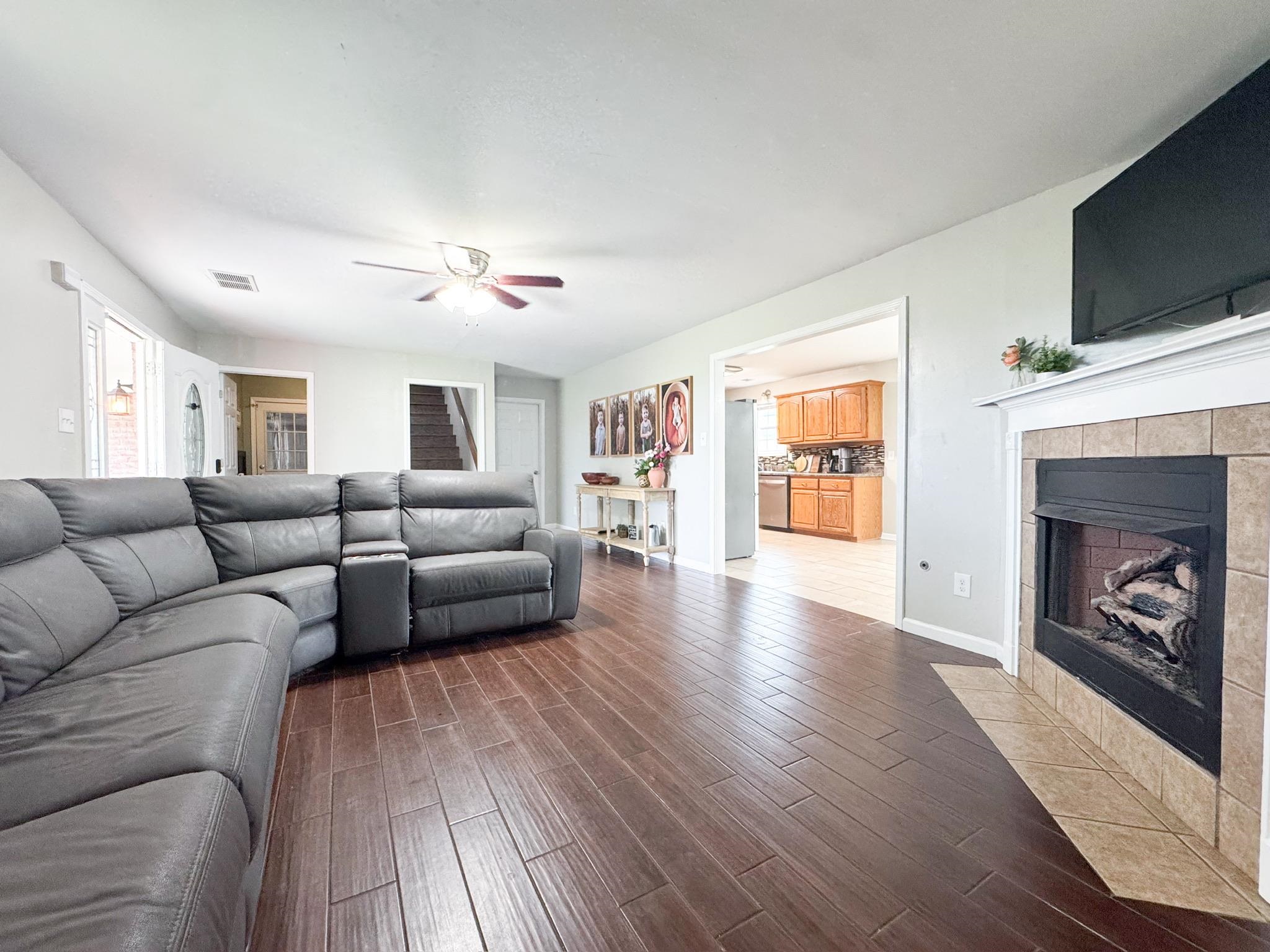 4776 Campground Road Munford, TN 38058 - Photo 3 of 25 a living room with furniture and a fireplace