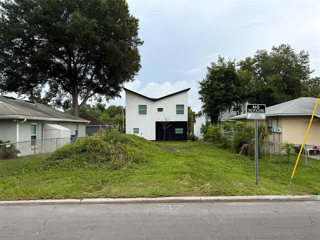 a view of house and outdoor kitchen