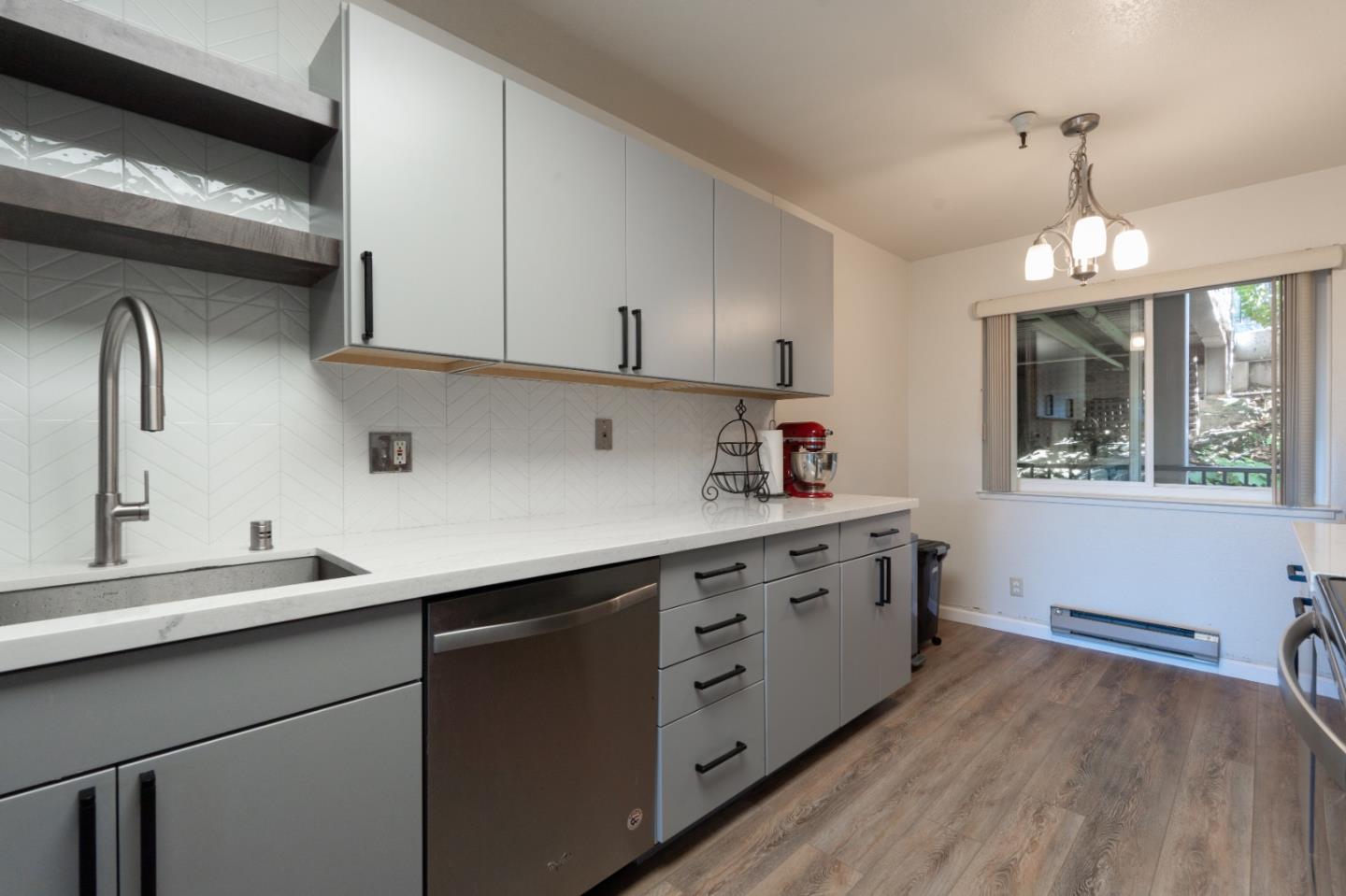 33 Shepherds Knoll Road Monterey, CA 93940 - Photo 13 of 22 a kitchen with cabinets wooden floor and a sink