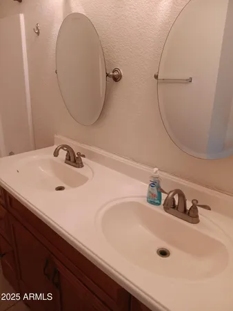 a bathroom with a shower and a sink