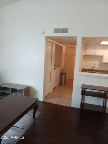 a kitchen with granite countertop a sink and cabinets