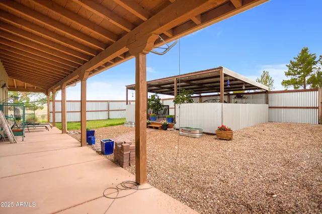 a kitchen with granite countertop a sink stainless steel appliances and cabinets