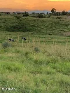 a view of a large pool with an outdoor space and seating area