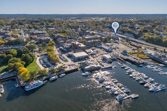 an aerial view of a house with a parking space
