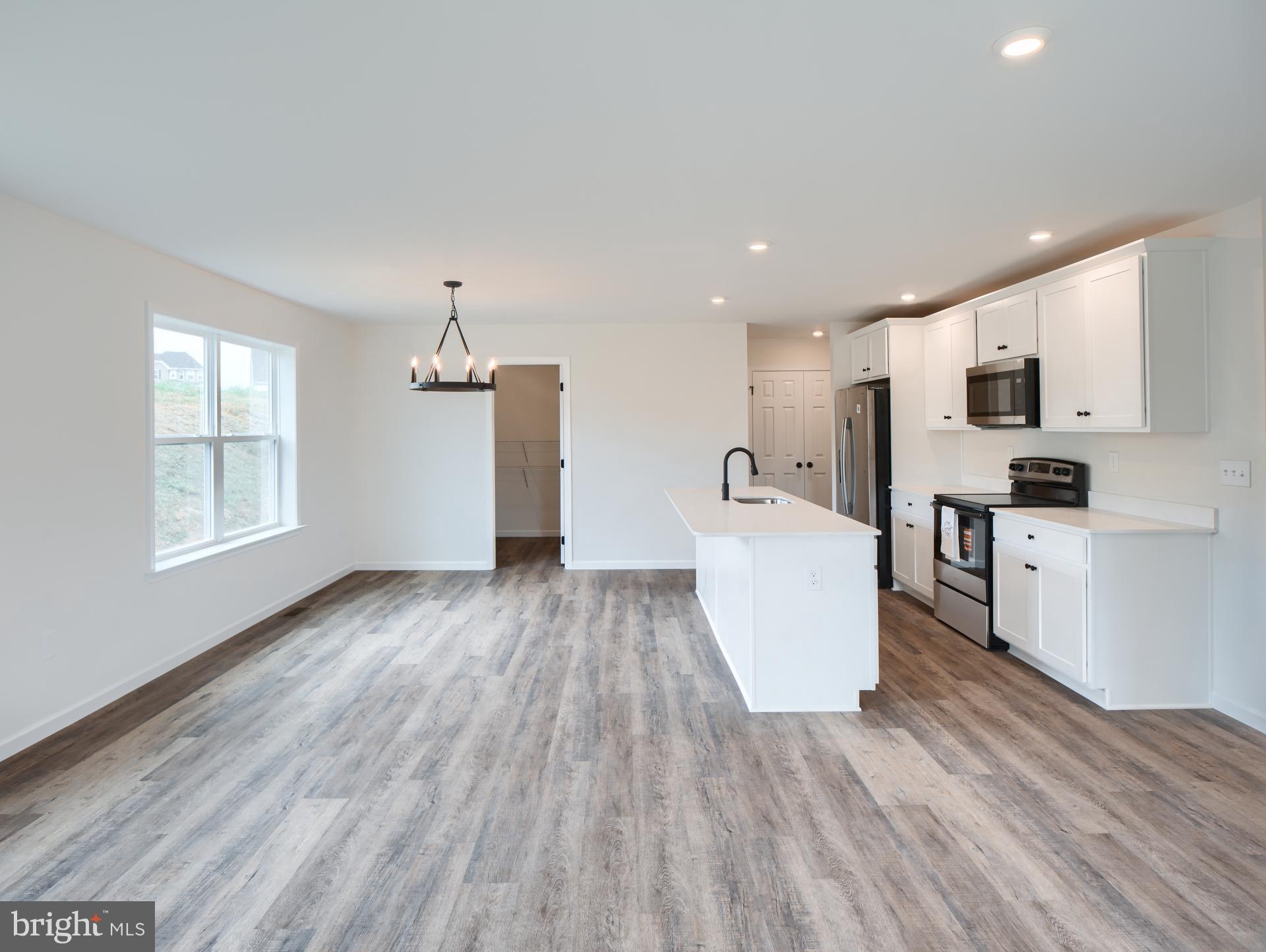 307 Boxwood Drive Windsor, PA 17366 - Photo 11 of 43 a view of kitchen with wooden floor and electronic appliances